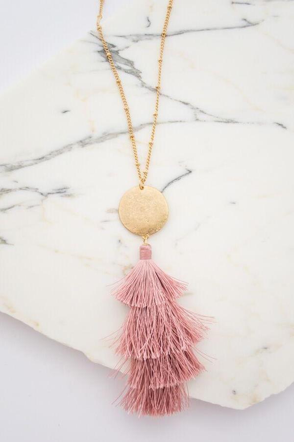 This statement pink tassel necklace is the perfect accessory to any outfit!