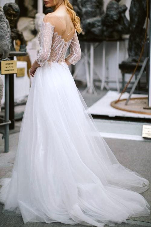Fantastic ivory tulle and lace wedding dress with embroidered lace bodice.