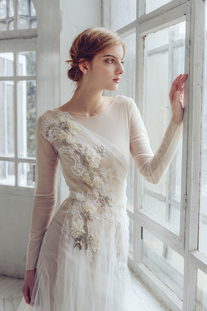 Tulle wedding dress, with hand embroidered top, button detail back and long train.